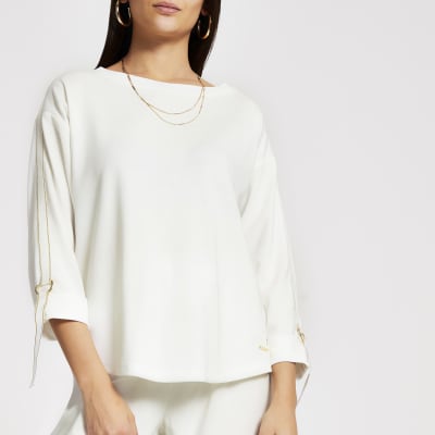 Cremefarbenes, langärmeliges Sweatshirt mit Glitzerband