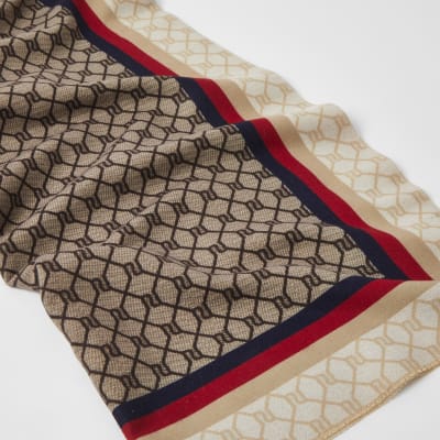 Beige gestreepte sjaal met RI-monogram print
