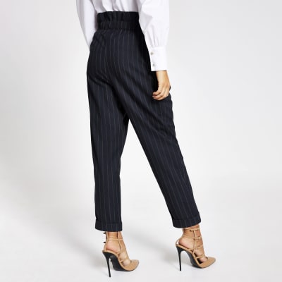 Navy pinstripe buckle peg leg trousers