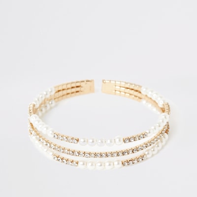 Goudkleurige met parels versierde gelaagde brede armband