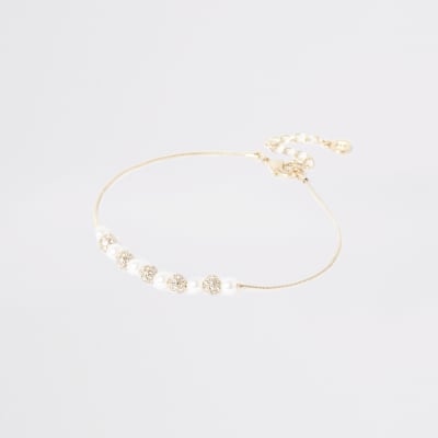 Goldene Fußkette mit Perlen- und Strassbesatz