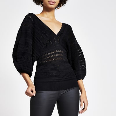 Zwarte fijngebreide top met ballonmouwen