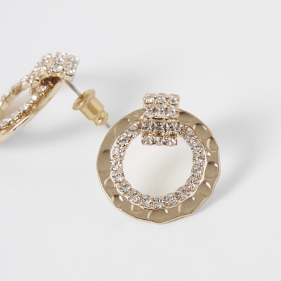 Gouden oorknopjes met met ring en siersteentjes