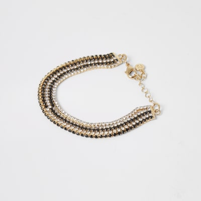 Gouden gelaagde armband met siersteentjes