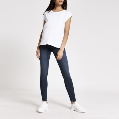 Molly – Jegging bleu maternité en dessous du ventre