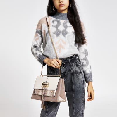 Sac à bandoulière beige foncé avec fermoir sur le devant