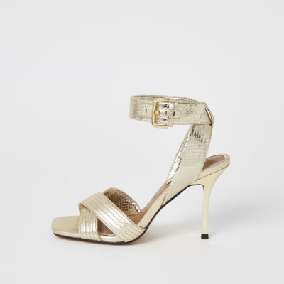 Gold metallic cross strap heeled sandals