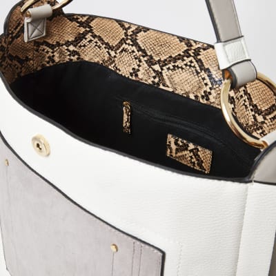 Graue Beuteltasche mit Quaste und Fronttasche