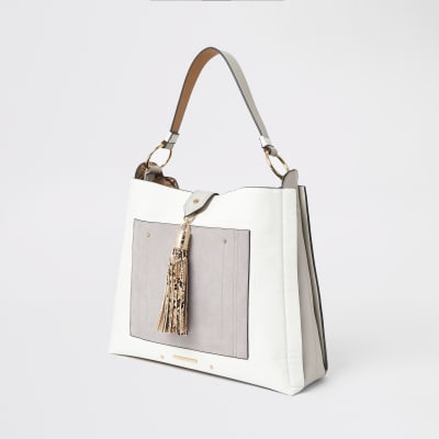 Grey tassel and pocket front slouch bag
