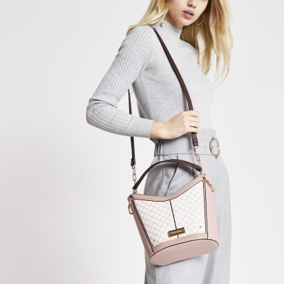 Roze diepe crossbodytas met RI-monogram