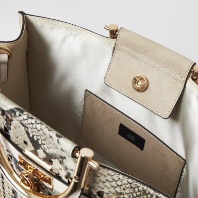 Cabas beige imprimé serpent clouté à découpes