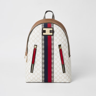 Sac à dos beige avec zip sur le devant et monogramme RI