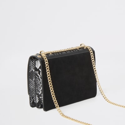 Schwarze Satchel-Umhängetasche mit Cut-outs und Nieten