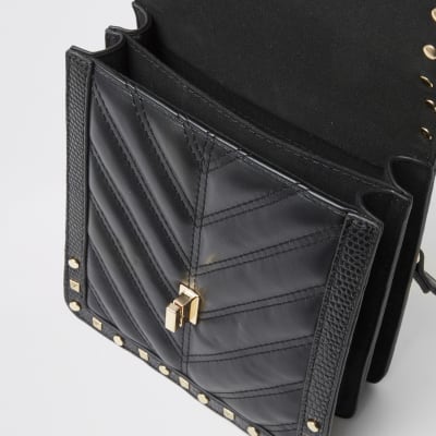 Black studded quilted cross body bag