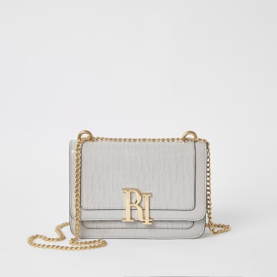 Grijze satchel schoudertas met RI-letters in reliëf