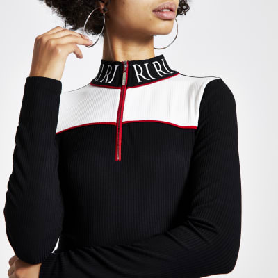 Schwarzes RI Oberteil mit Reißverschlusskragen und Colour-Block