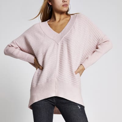 Lichtroze geribbelde pullover met V-hals