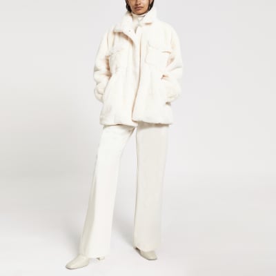 Mantel aus Kunstfell in Creme