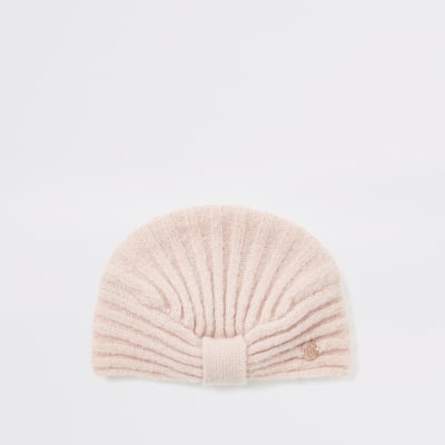 Pinkfarbene Mütze im Turbanstil und Rippenstrick für Babys