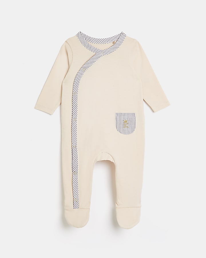 Baby beige RI cross over sleepsuit