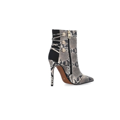 360 degree animation of product Beige animal print tie up heeled boots frame-13