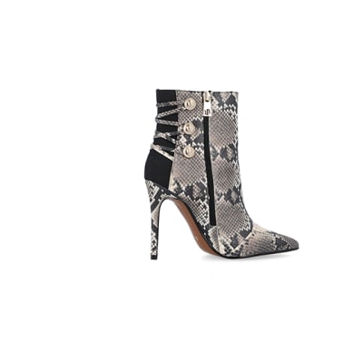 360 degree animation of product Beige animal print tie up heeled boots frame-14