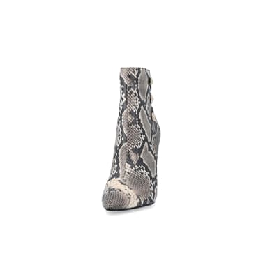 360 degree animation of product Beige animal print tie up heeled boots frame-22