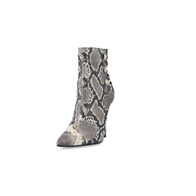 360 degree animation of product Beige animal print tie up heeled boots frame-23