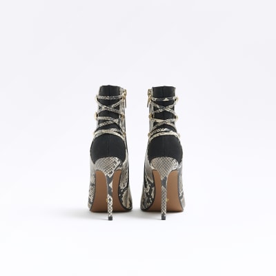 Beige animal print tie up heeled boots