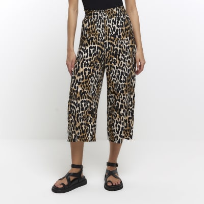 Beige animal print wide leg trousers