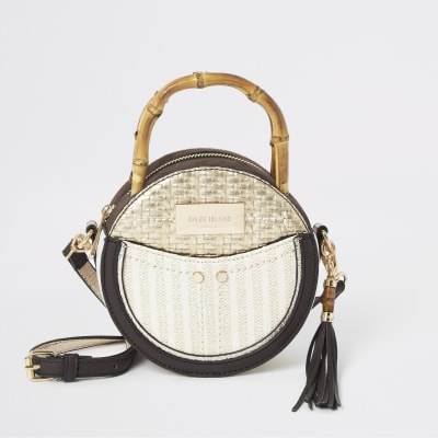 Beige bamboo handle circle cross body bag