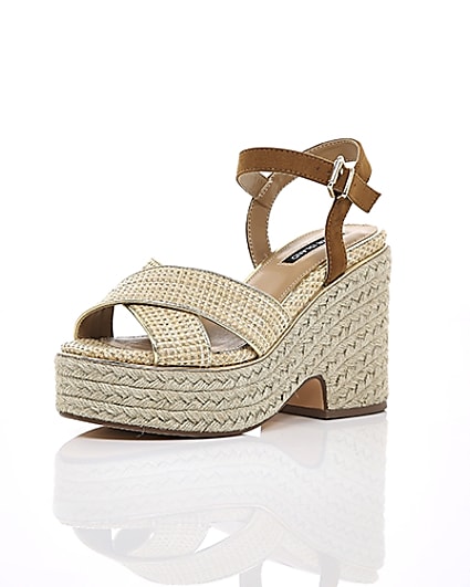 360 degree animation of product Beige cross strap espadrille wedges frame-0
