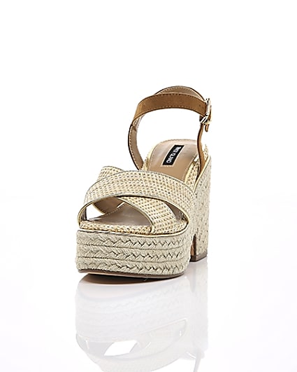 360 degree animation of product Beige cross strap espadrille wedges frame-2