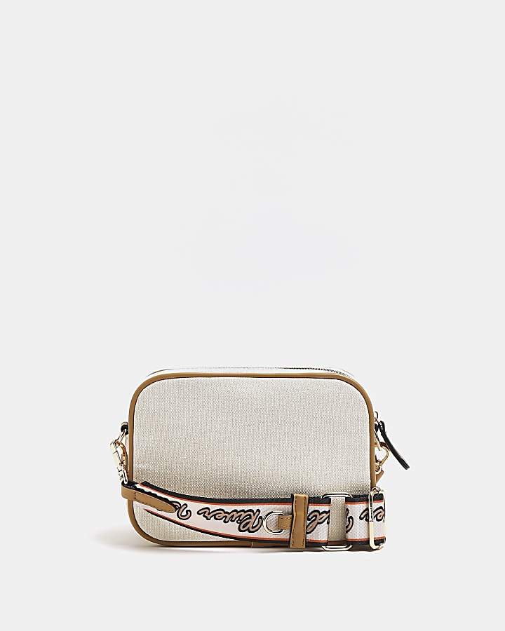 Beige embroidered patch cross body bag