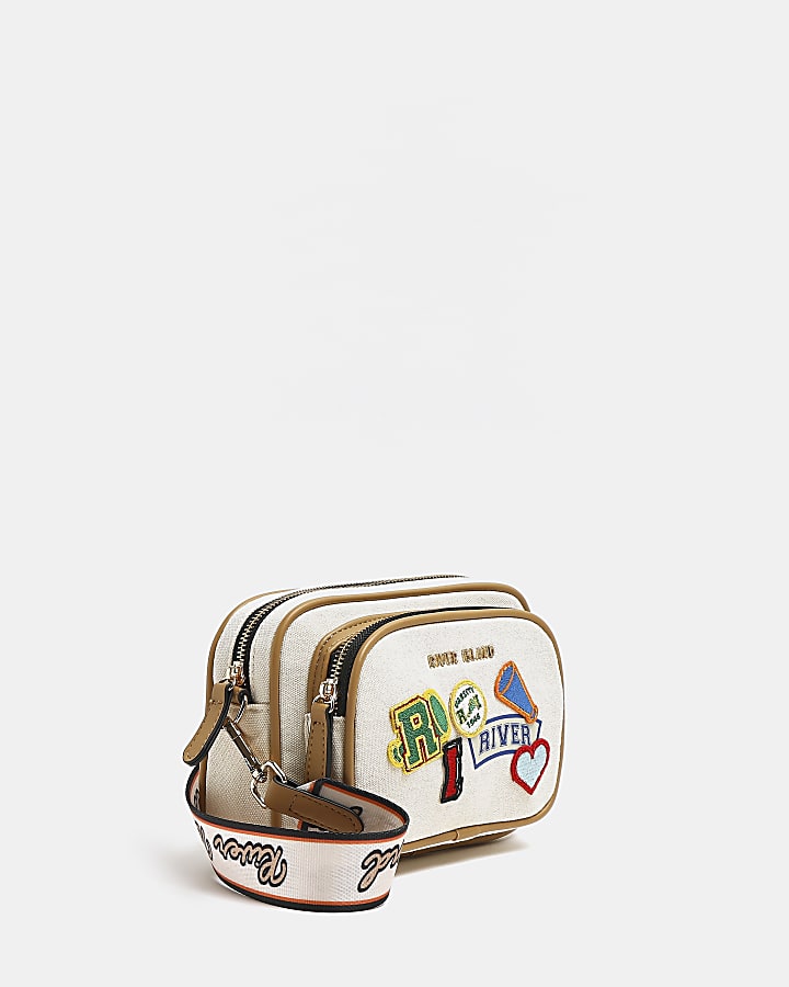Beige embroidered patch cross body bag