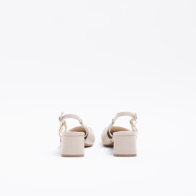 Beige heeled slingback shoes