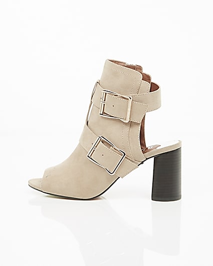 360 degree animation of product Beige multi buckle block heel shoe boots frame-21