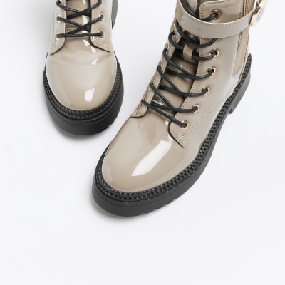 Beige patent buckle lace up boots