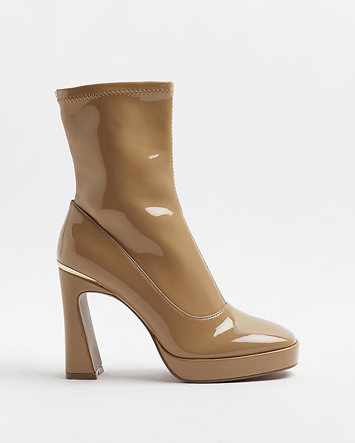 Beige patent heeled ankle boots