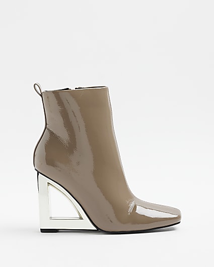 Beige patent wedge heeled ankle boots