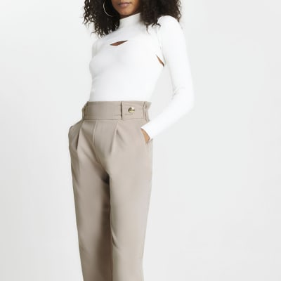 Beige pleated peg leg trousers