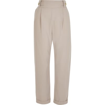 Beige pleated peg leg trousers