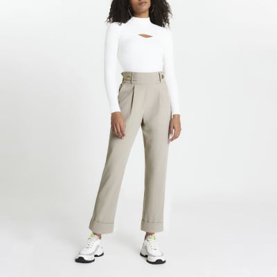Beige pleated peg leg trousers