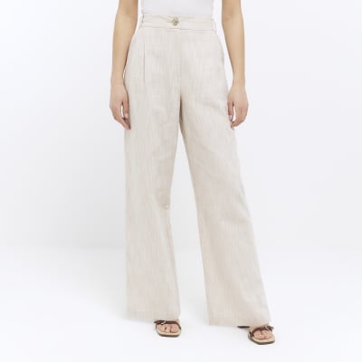 Beige pleated wide leg trousers | River Island