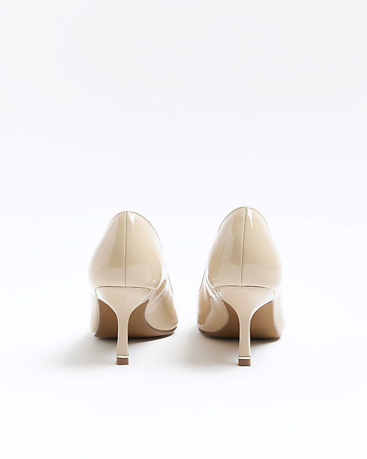 Beige pointed toe heeled court shoes