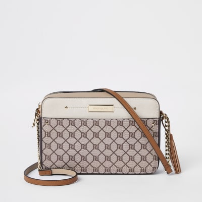 Beige RI monogram cross body bag | River Island