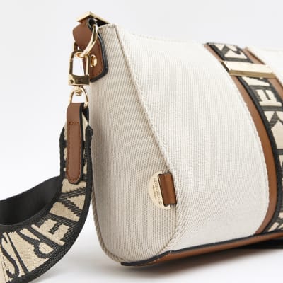 Beige RI monogram cross body bag River Island