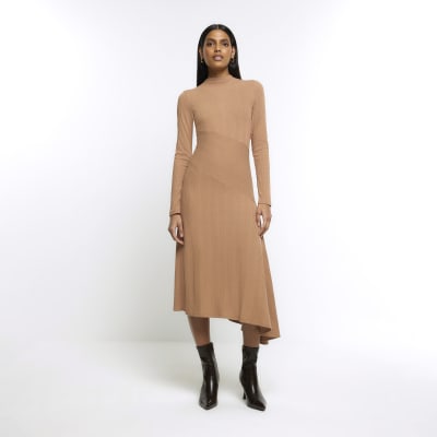 https://images.riverisland.com/is/image/RiverIsland/beige-rib-asymmetric-bodycon-midi-dress_902014_main?$ProductListingPortrait$