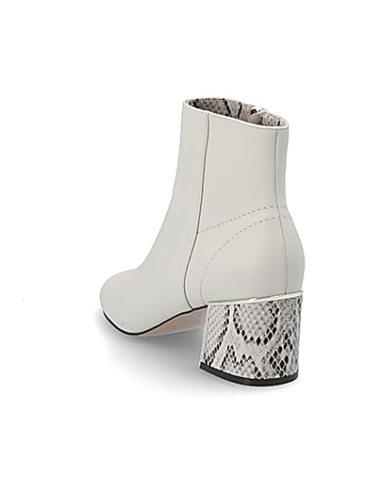 360 degree animation of product Beige snake print block heel boots frame-7