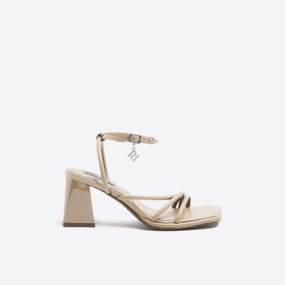 Beige strappy heeled sandals